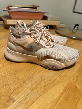 Nike Women’s Light Pink and Metallic Rose Athletic Sneakers